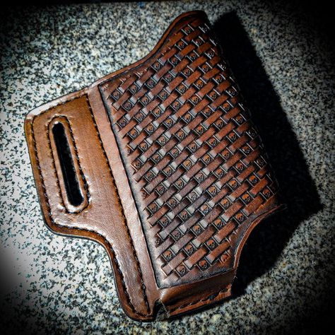 Dark brown leather cell phone case with a skull basket weave pattern going diagonal indirection. Perfect for wearing your phone on your hip. Leather Phone Holster Pattern, Leather Cell Phone Holster, Leather Phone Holster, Pancake Holster, Leather Cell Phone Cases, Guitar Straps, Tablet Cases, Cell Phone Holster, Tool Belt