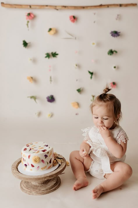 Bundt Smash Cake, 1st Birthday Flower Theme Photoshoot, Wildflower First Birthday Backdrop, Wildflower Cake Smash Photoshoot, Timeless First Birthday Photo, Floral 1st Birthday Photoshoot, Wild Flower First Birthday Photoshoot, Wildflower Cake Smash Photography, Flower First Birthday Photoshoot