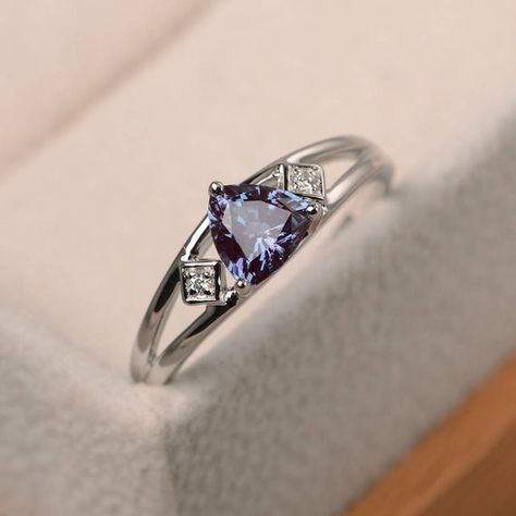 Alexandrite ring wedding ring trillion cut color changing | Etsy Alexandrite Ring Simple, Trillion Ring Designs, Trillion Cut Sapphire Ring, Trillion Cut Emerald Ring, Trillion Cut Engagement Ring, Trillion Cut Ring, Trillion Ring, Exclusive Engagement Rings, Gemstone Solitaire Ring