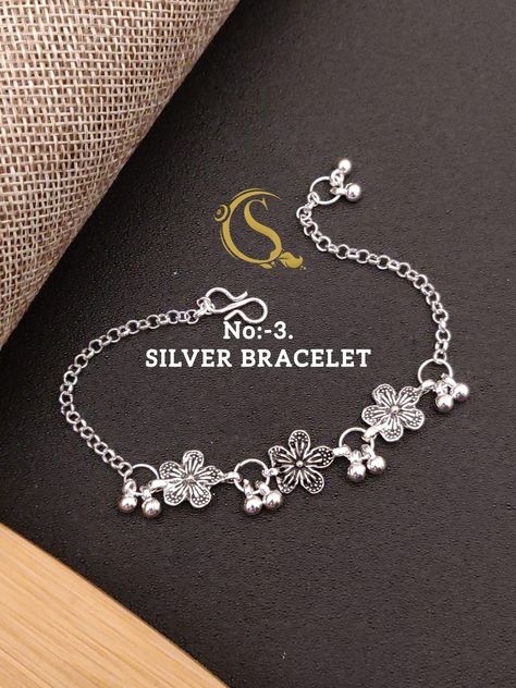 To buy this dm or whatsapp @ +91 93358 35609 #bracelet #goldenbracelet #silverbracelet #charms Silver Breslet Girl, Rakhi 2023, Payal Designs Silver, Silver Anklets Designs, Silver Payal, Oxidized Jewellery, Delicate Gold Bracelet, Silver Bracelet Designs, Silver Flower Bracelet