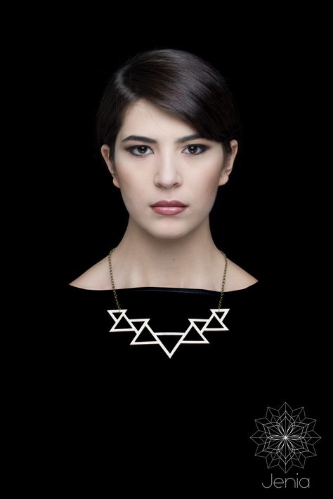 Triangle necklace . Geometries is a collection of lasercut and hand finished wood jewels.  The innovative approach to the contemporary jewelry design and the decision to keep the raw material as packaging  shows the machining process. The combination of basic figures reveal  the beauty of geometry.  materials: poplar wood, brass Laser Cut Necklace, Rectangle Necklace, Contemporary Jewelry Design, Laser Cut Jewelry, Mini Necklace, Triangle Necklace, Wooden Necklace, Wood Necklace, Wood Jewelry