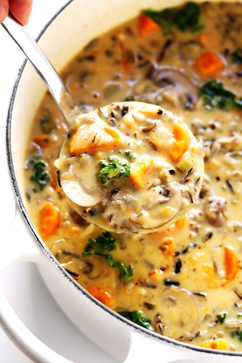 This Cozy Autumn Wild Rice Soup is the perfect fall comfort food! It's easy to make in the Instant Pot (pressure cooker), Crock-Pot (slow cooker), or on the stovetop. It's loaded with sweet potato, kale, mushrooms and other autumn veggies. It's easy to make gluten-free or vegan, if you would like. And it's SO delicious. | Gimme Some Oven #soup #dinner #vegetarian #glutenfree #vegan #comfortfood Autumn Wild Rice Soup, Autumn Wild Rice, Vegetarische Diners, Sandwich Vegetarian, Rice Soup Recipes, Fall Comfort Food, Resep Diet, Seasonal Produce, Wild Rice Soup