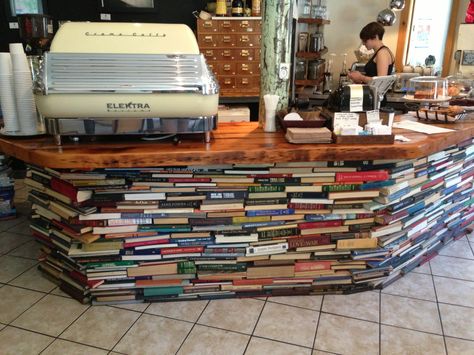 Cafe counter made of books, im sure theres a structure behind it too as i wouldn't rest that heavy Elektra on books alone! Bookish Ideas, Checkout Counter, Cafe Counter, Book Bar, Library Ideas, Amazing Spaces, Bar Counter, Coffee Shops, Coffee Shop