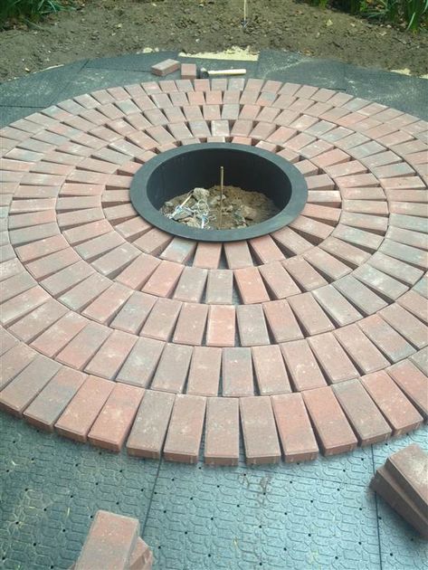 DIY brick patio Cheap Patio Pavers, Diy Brick Patio, Circular Patio, Diy Patio Pavers, Cheap Patio Furniture, Brick Patterns Patio, Cheap Garden, Brick Fire Pit, Brick Laying