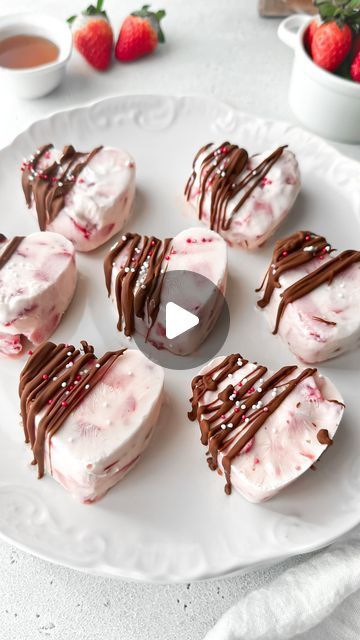 Kristel Talie on Instagram: "Strawberry Yogurt Bites 🍓✨These easy sweet treats are creamy, covered in chocolate and heart-shaped…perfect for Valentine’s Day💘!

You’ll need:

2 cups chopped strawberries
1 cup greek yogurt
2 tbsp honey (or less if the strawberries are already sweet)
1/2 cup chocolate chips
1 tsp coconut oil
Sprinkles (optional)

Place the strawberries, yogurt and honey in a bowl and mix until everything is combined. Place around 2 tbsp in each hole of the heart-shaped mould and freeze for at least 4 hours. Then, add the coconut oil to the chocolate chips and melt in the microwave in 30-second intervals, stirring in between until the chocolate becomes silky smooth. With the help of a spoon, drizzle chocolate onto each heart and place sprinkles on top. Keep in the freezer un Strawberry Yogurt Bites, Easy Sweet Treats, Valentine Food, Yogurt Bites, Yummy Deserts, Strawberry Yogurt, Valentines Food, 4 Hours, Chocolate Chips