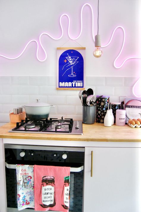 A Neon, Pink, and Eyeball Motif-Filled Victorian Terrace in South London | Apartment Therapy Neon Kitchen, Neon Home Decor, Pink Armchair, Neon Lights Bedroom, Neon Wall Art, All White Kitchen, White Backsplash, Kitchen Ceiling, Victorian Terrace