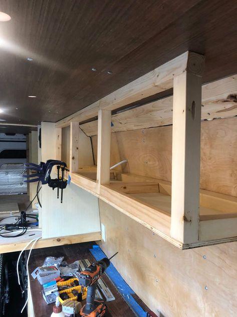 DIY VAN CONVERSION | OVERHEAD STORAGE – CHARLES STEMEN Camper Van Shelving Ideas, Camper Overhead Storage, Diy Van Kitchen, Van Cabinets Diy, Simple Van Conversion Ideas Layout, Van Shelving Ideas, Van Kitchen Ideas, Van Life Storage, Van Cabinets