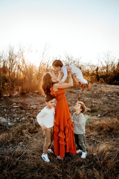 Family Photos Orange Dress, Family Photo Outfits Mom In Pants, Baltic Born Dress Family Photos, Rust Dress Family Photos, Orange Family Photo Outfits, Bohemian Family Photoshoot, September Family Photos, Holiday Family Outfits, Boho Family Photos