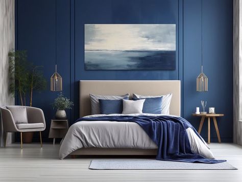 19 Incredible Coastal Bedroom Ideas to Achieve Beach Vibe Aesthetics 33 Ocean Blue Interior Design, Blue Wall Bedroom Decor Ideas, Navy Grey White Bedroom, Blue Accented Bedroom, Grey And Blue Room Ideas Bedroom, Deep Ocean Bedroom, Blue Grey Wall Paint, Contemporary Master Bedrooms Decor, Navy Blue Master Bedrooms Decor