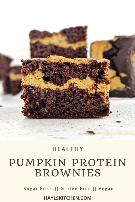 Pretty perfect Pumpkin Protein Brownies with a protein pumpkin swirl! These healthy pumpkin protein powder brownies are rich in chocolate and pumpkin spice flavor, use cocoa powder and no chocolate for a low calorie recipe! Low Calorie Pumpkin Brownies, Protein Pumpkin Brownies, Pumpkin Protein Brownies, Pumpkin Protein Dessert, Healthy Pumpkin Brownies, Chocolate Pumpkin Desserts, Pumpkin Cheesecake Swirl, Protein Powder Brownies, Tangerine Recipes