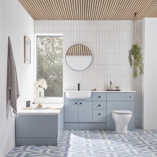 This bathroom interior encapsulates the soft and inviting style of beach house interiors. The blue interior palette combines complimentary hues to create a space that feels homely. Cottagecore Bathrooms, Pastel Bathroom, Bathroom Furniture Design, Fitted Bathroom Furniture, Relaxing Bathroom, Coastal Interiors Design, Basin Unit, Fitted Bathroom, Coastal Interiors