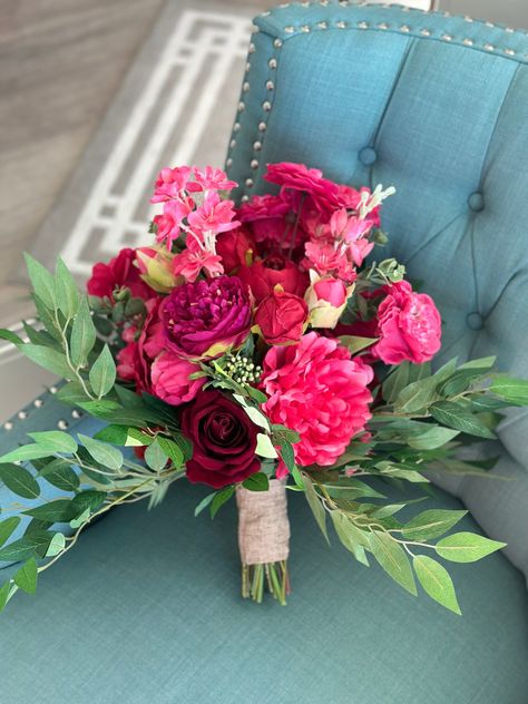 Stunning Wedding bouquet in fuchsia, hot pink, purple, red, and magenta. This bouquet is made with high quality silk flowers consisting of dahlias, roses, hydrangeas, and Italian Ruscus leaves. It has all the elegance, beauty and romance you could want and will complement and wedding dress! Each floral arrangement is handmade with great attention to detail and fine craftsmanship. Bouquets are finished with ribbon color of your choice. You can be sure to love the product you receive and it will l Fall Pink Floral Arrangements, Hot Pink Wedding Flowers Centerpieces, White Roses Flower Bouquet, Hot Pink Hoco Bouquet, Pink Red Bridal Bouquet, Hot Pink Beach Wedding, Red Pink Wedding Flowers, Red Dress Flowers Bouquets, Pink Red And Green Wedding