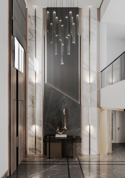 Feature Wall Hotel Lobby, Lobby Double Height Wall Design, Entrance Lobby Design Residential Luxury, Void Wall Design, Double Height Foyer Design, Double Height Wall Design Modern Luxury, Art Deco Lobby Design, Lobby Design House Entrance, Hotel Foyer Design