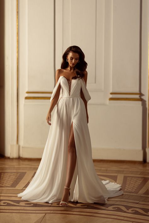 The dress appears to be expertly crafted, with attention to detail evident in the design. Corset Back Dress, Wedding Dress Bustle, A Line Bridal Gowns, Chiffon Wedding Dress, Winter Wedding Dress, Elegant Bride, Custom Wedding Dress, Stunning Gowns, Necklines For Dresses