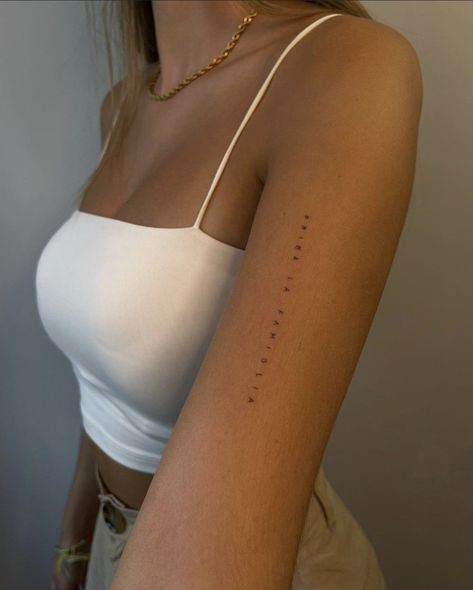 Arm Tattoo Women Minimalist, Minimalistic Arm Tattoos For Women, Horizontal Back Tattoo Women, Tattoo Inner Bicep Woman, Dainty Upper Arm Tattoos For Women, Sensitive Tattoo Words, Vertical Arm Tattoos For Women, Back Of Arm Tattoo Women Words, Front Of Bicep Tattoo