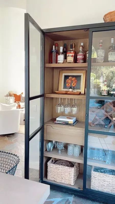 Glass Cabinets Bar Area, Curio Cabinet Dining Room, Curio Cabinet Bookcase, Cabinet Bookshelf Diy, Open Bar Cabinet, Bar Cabinet Next To Fireplace, Tall Bar Cabinet Styling, Tall Black Curio Cabinet, Bar Cabinet In Dining Room Ideas