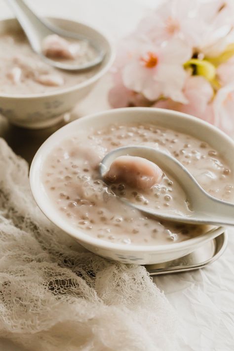 A spoonful of taro sago soup in a white bowl. Coconut Sago, Tong Sui, Sago Dessert, Taro Recipes, Chinese Dessert Recipe, Bean Curd Skin, Cooking With Coconut Milk, Red Bean Soup, Tofu Pudding