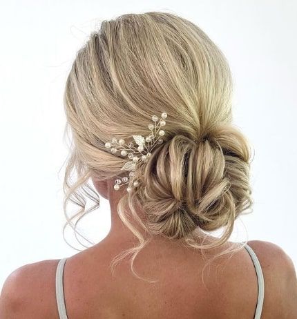 Ousled Low Updo Bun Inspiration Maid Of Honor Hairstyles Low Buns, Low Bun Updo Bridesmaid, Low Side Bun Bridesmaid Hair, Bridesmaid Hair Low Updo, Bridesmaid Hair Updo With Flowers, Deb Hairstyles Short Hair, Low Bun Wedding Hair With Headpiece, Low Messy Bridal Bun, Races Hairstyles Fascinator