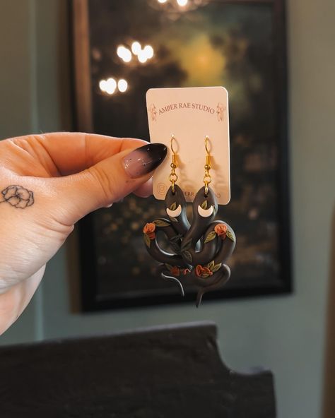 Happy Friday! Here’s some new earring designs from this week 🖤 Lots of dark spring natures vibes going on for you spooky baddies . . . . #spookyaesthetic #clayearrings #handmadejewelry #earringshandmade #polymerclaycreations #darknature #snakeearrings #floralearrings #darkcottagecore #witchyart #forestwitch #clayjewelry Amber Rae, Dark Spring, Clay Sculpting, Dark Cottagecore, Snake Earrings, Clay Earring, Earring Designs, Spring Nature, Sculpting Clay