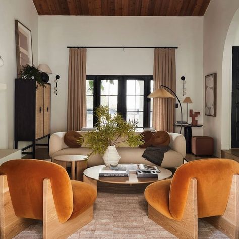 Earth tones with a POP of velvet orange loveliness 🍊Would you go bold and add a pop of color or stick to neutrals??? . . . . . . . . . By: @bobby @akindofhome @tramp.studio #interiordesigner #interiordesign #californiainteriordesigner #socaldesigner #sandiego #sandiegohomes #coastaldesigners #localcontractors #homediyinspo #homedecorinspo #interiorstylists #springhomedecor Neutral Interiors With Pops Of Color, Neutral Interior With Pops Of Color, Neutral Home Decor With Pops Of Color, Neutral Home With Pops Of Color, Neutral Room With Pop Of Color, Neutral With Pop Of Color Living Room, Neutral Living Room With Pop Of Color, Earth Tones Living Room, Warm Living Room Colors