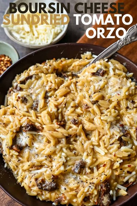 Boursin Cheese Sundried Tomato Orzo. A quick and easy one pot side dish made with orzo pasta in a creamy boursin cheese parmesan sundried tomato sauce. Orzo Recipes With Sundried Tomatoes, Boursin And Sun Dried Tomato Orzo Bake, Boisin Cheese Orzo, Orzo Pasta Casserole, Orzo Pasta Sundried Tomatoes, Creamy Sundried Tomato Orzo, Orzo With Sundried Tomatoes And Spinach, Orzo Sun Dried Tomato Boursin, Meatloaf With Boursin Cheese