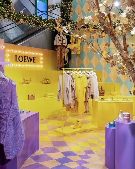 Loewe Takes Over Printemps with a Colorful Christmas – WindowsWear Orange Peel Candle, Retail Space Design, Golden Tree, Candle Store, Event Activities, Colorful Christmas, Urban Setting, Store Interior, Retail Space