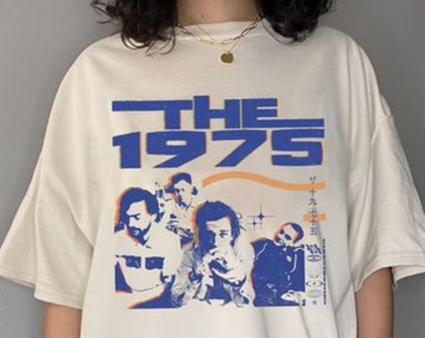 The 1975 Vintage Graphic T-shirt Fan Gifts Check more at https://redfoxpod.com/product/the-1975-vintage-graphic-t-shirt-fan-gifts/ The 1975 Merch, The 1975 T Shirt, The 1975 Shirt, Reunion Shirts, Merch Ideas, Space Lovers, Air Supply, Graphic Tshirt Design, The 1975