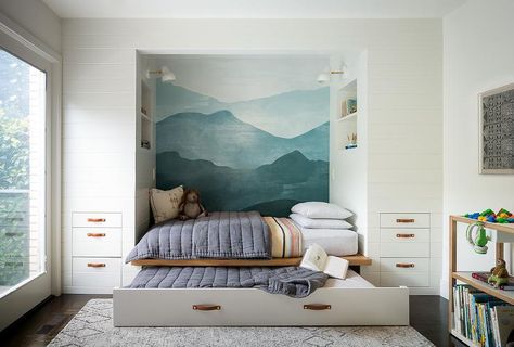 Built in twin bed and trundle featuring storage drawers and cubbies accented with leather straps. Painted Mountains, Bed Nook, Property Ideas, Mountain Mural, Built In Bed, Transitional Bedroom, Grand Art Mural, Mountain Wallpaper, Built In Furniture