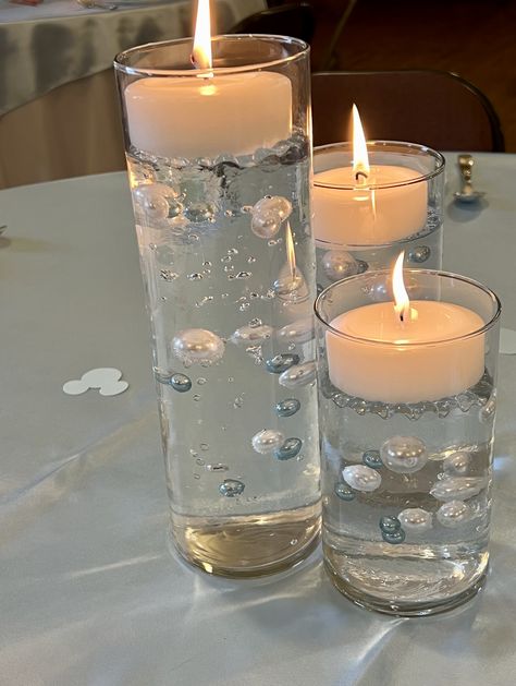 Floating Candles Floating Pearls, Floating Snowflake Centerpiece, Water Beads Ideas Diy Floating Candles, Floating Pearls Centerpiece, Pearl Candle Centerpiece, Blue Floating Candles, Snowflake Wedding Theme, Water Centerpieces, Snowflake Centerpieces