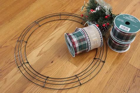 How to Make a Ribbon Wreath | eHow Round Wire Wreath Ideas, Wide Ribbon Crafts Ideas, Wire Ribbon Wreath Diy, Ribbon Wreaths Diy, Wire Wreath Ideas, Make A Ribbon Wreath, Diy Floral Hoop, Wire Christmas Wreath, Wire Ribbon Wreath