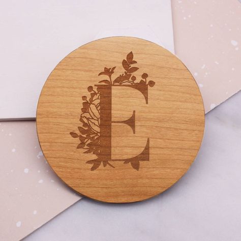 This beautiful wooden coaster is etched with a botanical initial design, perfect for a gift to a loved one or teacher.You can enter in one initial or number into the box provided.This wooden coaster is a practical and sentimental gift which can be cherished for years to come.The coaster is laser cut from sustainably sourced cherry wood veneer and the detail is laser etched onto the surface. The veneered finish makes this a strong and durable coaster.The coaster is just under 9cm in diameter ... Wooden Coaster Ideas, Personalized Wood Coasters, Woodburning Ideas, Pyrography Designs, Laser Crafts, Workshop Projects, Coaster Ideas, Sell Ideas, Survival Knots