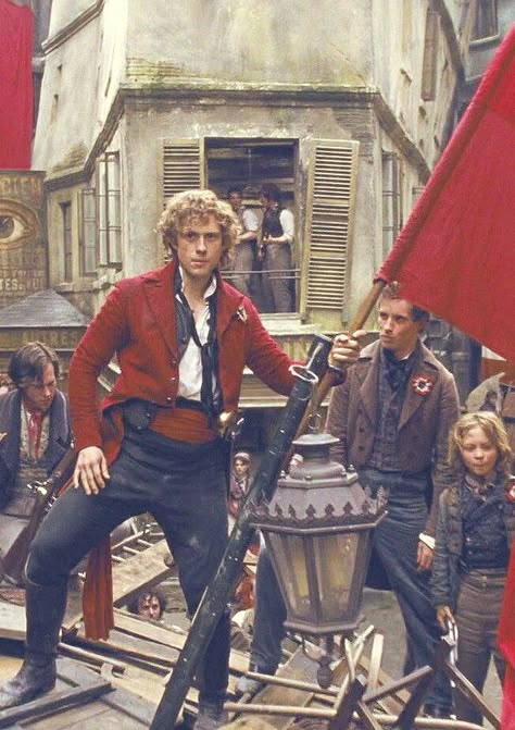 Marius looks like he's trying to make Enjolras' head explode. Enjolras Les Mis, Les Miserables Costumes, Napoleon French, Les Miserable, Man Looks, Aaron Tveit, Napoleon Bonaparte, Theatre Nerds, To The Bone