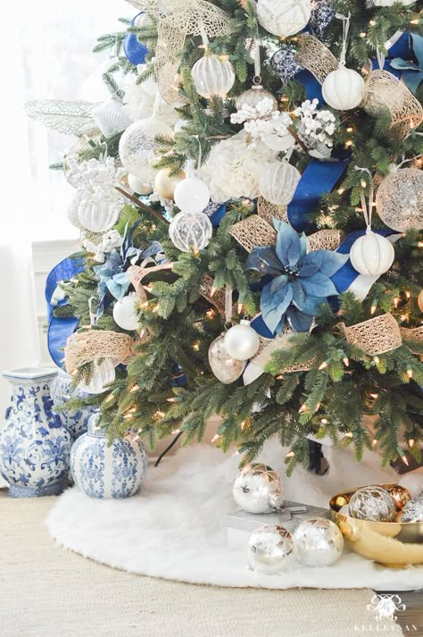 blue-white-and-gold-christmas-tree-with-fur-skirt Ideas Decoracion Navidad, Blue Christmas Tree Decorations, Blue Christmas Decor, Silver Christmas Decorations, Tree Themes, Blue Christmas Tree, Silver Christmas Tree, Gold Christmas Decorations, White Christmas Trees