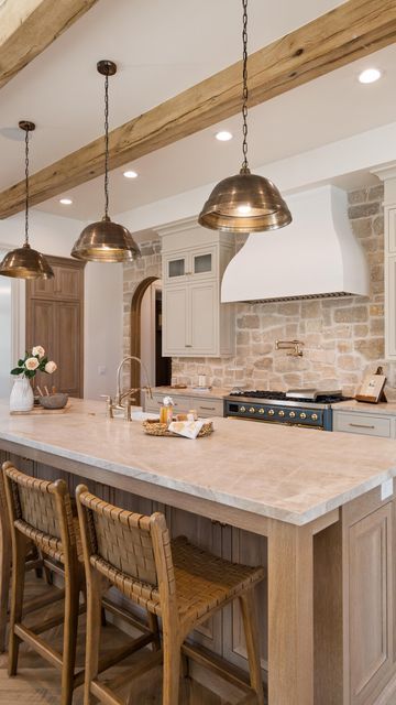 Davies Design Build on Instagram: "The kitchen in our 2023 @uvparade home was a fan favorite! We loved taking our clients vision and bringing it to life. Here are the details! -The stone we used is from @beehivebrickandstone and we used the Bonneville stone with white grout. -The cabinet color is SW Accessible Beige. #kitchendesign #cabinetdesign #designbuild #sketchup #utahbuilder #utahcustomhomebuilder #constructbuild #buildersofig #luxedesign #beautifulhome #interiorarchitecture #luxehome #dreamhome #utah #designbuild #construction #constructionlife #stone #realestate #design #interiordesign #finishcarpentry #lightingdesign #kitchenbacksplash #kitcheninspiration #kitchen" Decor Glass Jars, Barndo Kitchen, Green Country Kitchen, Kitchen Soffit, Backsplash Trends, Stone Backsplash Kitchen, Beige Cabinets, Lake House Kitchen, French Style Homes