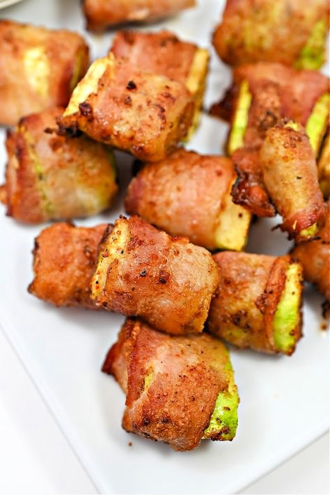 How do you make zucchini taste better? You wrap it in bacon and fry it! These air fried zucchini bites are the best snack or appetizer. Zucchini Bites After making this easy air fryer recipe, zucchini just might become your favorite vegetable. The bacon becomes extra crispy, and the zucchini cooks perfectly. The zucchini is seasoned perfectly with a combination of bold and earthy spices. And you can change the spice combination to whatever you like.  This recipe makes four servings - and with Bacon Wrapped Zucchini, Stylish Cravings, Bacon Chili, Cranberry Chicken Salad, Zucchini Bites, Keto Bacon, Spice Combinations, Mini Sweet Peppers, Classic Appetizers