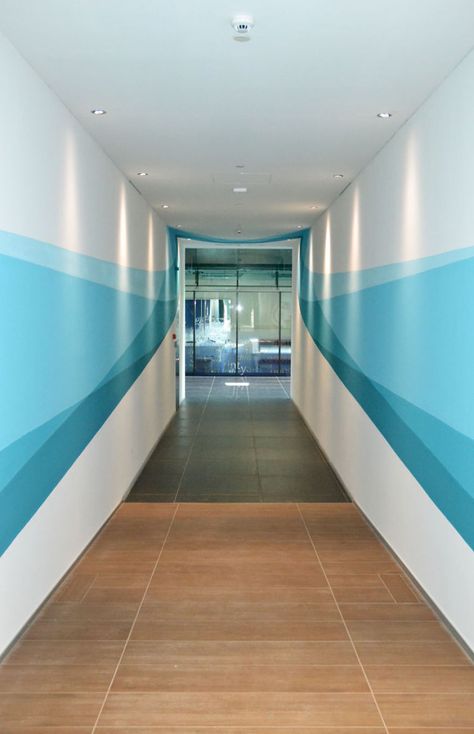 Our Mural Changes Shape As You Walk Through It Wall Painting Ideas, Office Wall Design, Corridor Design, Hospital Interior, School Interior, Walter Gropius, Hospital Interior Design, Hospital Design, Healthcare Design