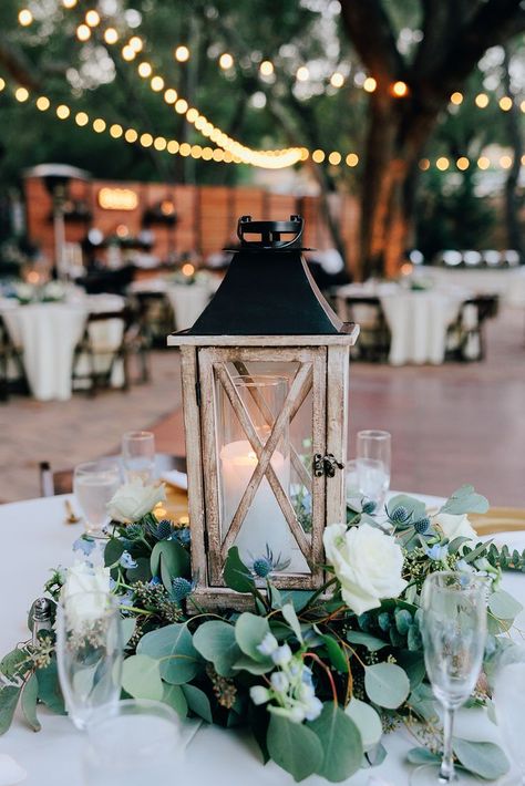 Wedding Decorations With Lanterns, Wedding Table Centerpieces Sage Green, Centerpiece With Lantern, Greenery Centerpiece Wedding Round Table, Wooden Tables Wedding Reception, Eucalyptus Table Centerpiece, Wedding Table Centerpieces Lanterns, Wedding Centerpieces With Lanterns And Greenery, Circle Table Centerpieces Wedding