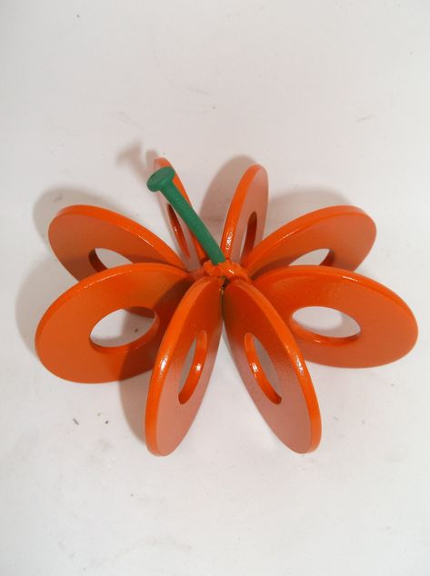 "Who would have thought that cute washers could turn into a pumpkin?   This Pumpkin is handcrafted using 8 small recycled 5/8 inch washers, and then painted orange along with a green stem. It makes a wonderful gift or the perfect piece for your home decor.  It is a great decoration all year round but, especially for Halloween.   SIZE: 4\" Width x 4\" Depth x 3\" Height. Dimensions are approximate and may differ slightly. HANDMADE IN THE USA When looking at the prices of these items please take i Scrap Metal Sculpture Junk Art, Halloween Welding Projects, Metal Pumpkins Decor, Halloween Metal Art, Cool Welding Projects Ideas, Small Welding Projects Ideas, Metal Projects That Sell, Scrap Metal Projects, Simple Welding Projects