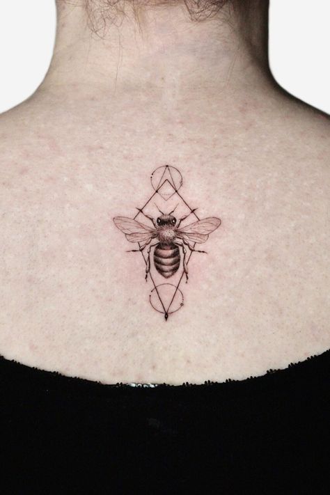 Geometric bee tattoo on the back Bee Chest Tattoo Men, Bee Geometric Tattoo, Bee Tattoo Black And White, Geometric Tattoo Ideas, Tattoos For Ladies, Wasp Tattoo, Bee Outline, Bee Tattoos, Honeycomb Tattoo