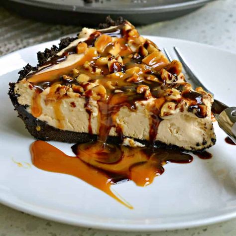 This easy no bake Peanut Butter Pie is a luscious dessert made with cream cheese, peanut butter, and whipped cream all topped with chopped peanuts, chocolate and butterscotch sauce. Easy Peanut Butter Pie, Small Town Woman, No Bake Peanut Butter, Chocolate Peanut Butter Pie, Thanksgiving Food Desserts, Peanut Butter Cheesecake, Peanut Butter Filling, Peanut Butter Pie, Easy Peanut Butter