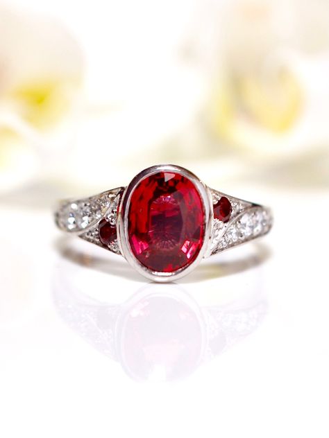 Congratulations Chris and Christine! Chris contacted me to commission a one of a kind engagement ring for his love Christine. He knew that she loved red and wanted a bezel setting on the stone and Chris loved the idea of the band swooping up to meet the centre setting. We looked at rubies but they were all a little too pink. This fiery red spinel had just the right shade of red and a beautiful sparkle. We looked at more traditional designs but Chris looked this twisted band with little pop... Spinel Engagement Ring, Baguette Halo, Spinel Engagement Rings, Engagement Ring For Him, Diamond Sapphire Engagement Ring, Sapphire Diamond Engagement, Halo 3, Red Spinel, Teal Sapphire