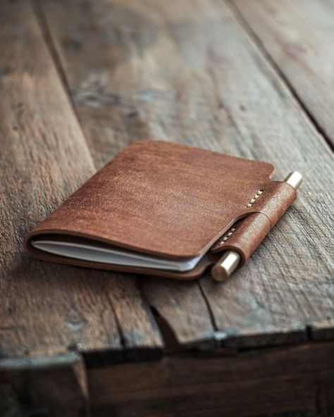 "Handmade leather journal with a place for pen. Write something down, sketch an idea or just keep a diary. This refillable notebook cover is made with 2mm (5oz) full grain leather so it will shield your important content. It's very minimal and convenient as the pen slot keeps the cover closed. In this leather notebook cover there's room for two interchangeable notebooks (9cm x 14cm / 3.5\" x 5.5\") that are the standard sized Moleskine, Field Notes and Word notebooks. The default package contains the brass pen and one blank Luava notebook (48 pages). You can add a 3-pack to the order if you want.  The package comes with a brass ballpoint pen that has interchangeable ink cartridge (pilot g2 refill) and that is very unique in its minimalistic form. It comes with one cartridge filled with bla Leather Sketchbook Cover, Leather Moleskine Cover, Handmade Leather Notebook, Brown Leather Journal, Refillable Notebook, Diy En Cuir, Leather Sketchbook, Leather Book Covers, Leather Notebook Cover