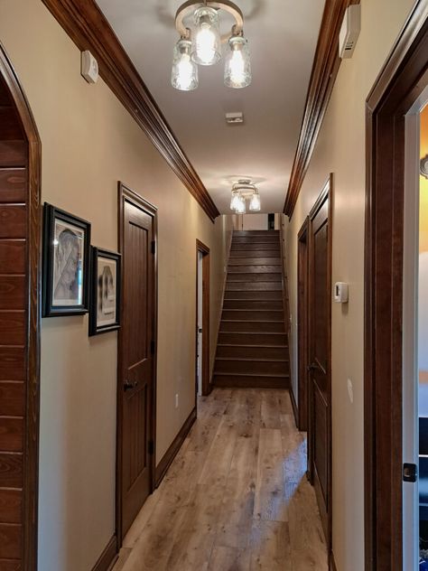 Learn which paint colors are good for making a dark hallway or staircase look brighter. Learn about high and low contrast, white trim vs wood trim, and more. 

#kyliem #paintingtips #woodtrim #hallway #stairs Tan Paint Colors, Light Paint Colors, Tan Paint, Light Grey Paint Colors, Best Neutral Paint Colors, Dark Hallway, Trim Paint Color, Beige Paint Colors, Dark Trim