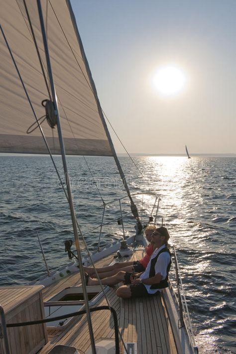 Couple sailing on yacht. Couple relaxing on deck of yacht with sun in background , #AD, #yacht, #sailing, #Couple, #relaxing, #background #ad Yacht Couple, Sailing Couple, Background Couple, Relaxing Background, Yacht Sailing, Skyfall, Background Background, Sailing Yacht, Luxury Life