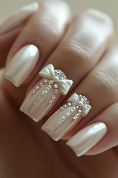 Feminine Ribbon Accent Bridal Nails Pearly White Wedding Nails, Vintage Wedding Nails For Bride, Bride Nails 2024, Nail Bride Wedding, Country Wedding Nails For Bride, Nail Wedding For Bride, Wedding Anniversary Nails Ideas, Wedding Nails For Bride Pearl, Bridal Nail Art Designs Wedding Day