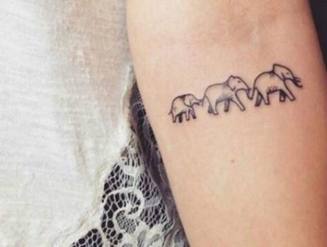 The  leader of a group of elephants is always an older female who fiercely protects and guides the young. This tattoo reminds you of the powerful, loyal woman with deep family values that you are. Tiny Elephant Tattoo, Small Sister Tattoos, Elephant Tattoo Design, Small Tattoos With Meaning, Family Tattoo, Geniale Tattoos, Delicate Tattoo, Elephant Tattoo, Elephant Tattoos