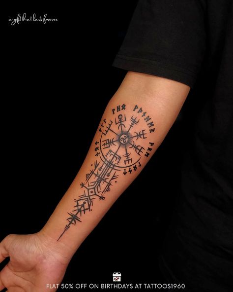 A Viking compass tattoo, also known as a Vegvisir, is an ancient symbol that is often associated with strength, determination, and guidance. This tattoo features a circular shape with eight different rays that point in different directions. The symbol was originally used by the Vikings as a way to navigate and find their way home. The Vegvisir tattoo has become increasingly popular in recent years as a way to represent one's own sense of direction and purpose in life. Some people choose to inclu Viking Compass Tattoo, History Tattoos, Warrior Tattoos, Best Tattoo Designs, Tattoo Trends, Symbolic Tattoos, Meaningful Tattoos, Minimalist Tattoo, Compass Tattoo