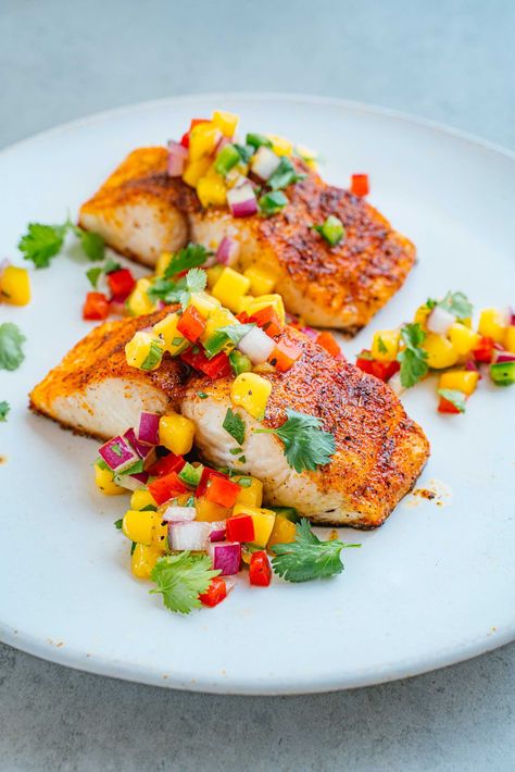 Caribbean Blackened Sea Bass with Mango Salsa | PureFish ® Sea Bass With Mango Salsa, Blackened Fish With Mango Salsa, Mango Salsa Recipe Fish, Sea Bass Recipes Healthy, Seabass Recipe, Mango Salsa Fish, Cooking Sea Bass, Mango Fish, Bass Recipes