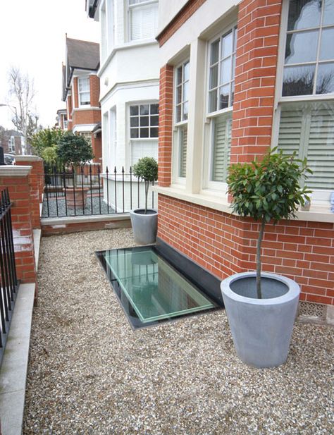 A glass basement fire escape at the front of a period house. 2.6m by 1.1m.  By meia - Moving Elements in Architecture.  meia.co.uk Uk Cellar Conversion, Cellar Window Ideas, Basement Light Well Ideas, Basement Window Exterior, Basement Windows Exterior, Victorian Basement Conversion, Victorian Cellar Conversion Ideas, Cellar Conversion Ideas, Cellar Window