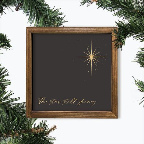 The star still shines.  His light still shines today. Accent your Christmas decor with this stunning printed sign with a gold foil star, soft black background and shiny gold splashes resting behind the star. Artwork is printed on 100% canvas. The frame is made of pine wood and finished with a walnut stain to enhance the natural grain. The box framed wall decor will make a wonderful gift for someone special this holiday season for a wall or table. Choose from a 6x6, 8x8, or 10x10 inches walnut st Christ Christmas Decor, Chalkboard Christmas Signs, Church Christmas Decor, Christian Christmas Decor, Christmas Wood Signs, Star Artwork, Star Gifts, Star Wall Decor, Chalkboard Wall Art